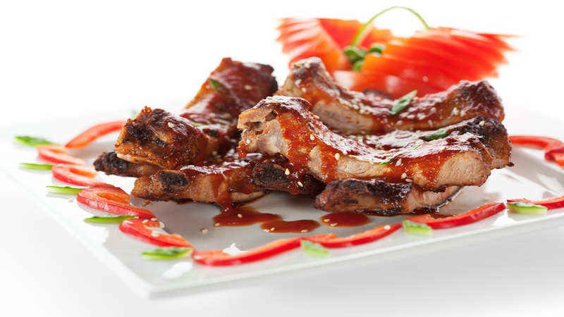 11417736 – hot meat dishes – bbq ribs with tomatoes and spicy sauce